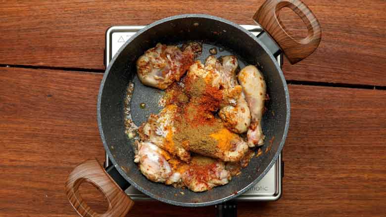 Add turmeric powder, salt, half prepared masala powder, and garam masala powder - Mangalorean Chicken Sukka Recipe