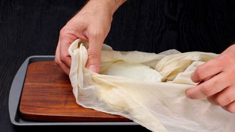 Remove both weight and cloth from the pressed paneer - How to make paneer at home from milk