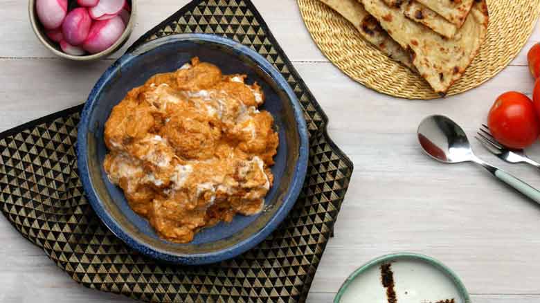 Serve Malai Kofta with naan or Parantha