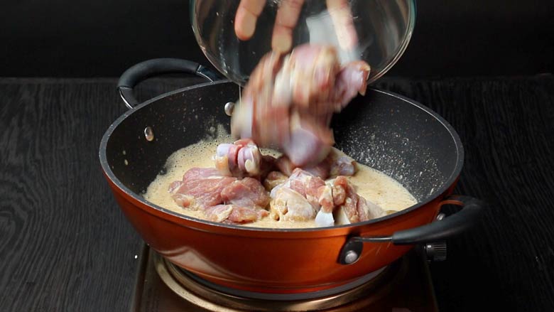 Add marinated mutton to the bay leaf (tej patta), cloves (laung), cinnamon (dalchini), and prepared biryani masala powder in ghee-oil mixture - Hyderabadi Dum Biryani Recipe