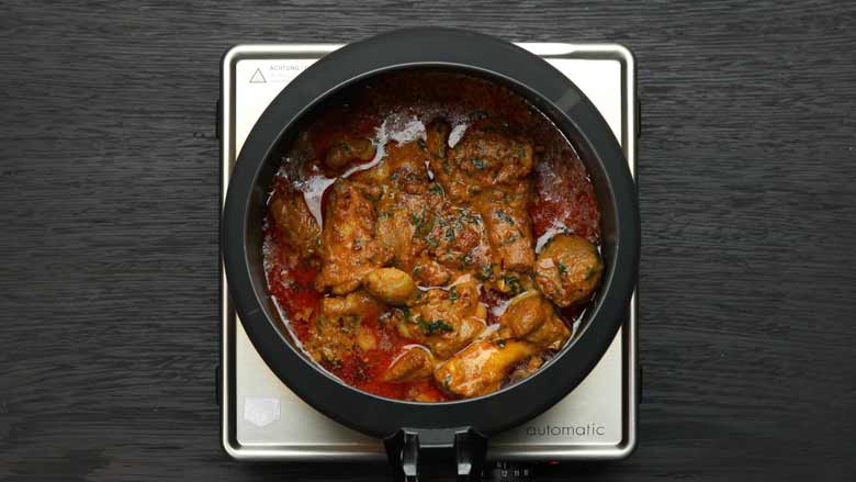 Transfer to a pressure cooker and cook for 15 minutes after the cooker reaches full pressure (1st whistle) - Hyderabadi Dum Biryani