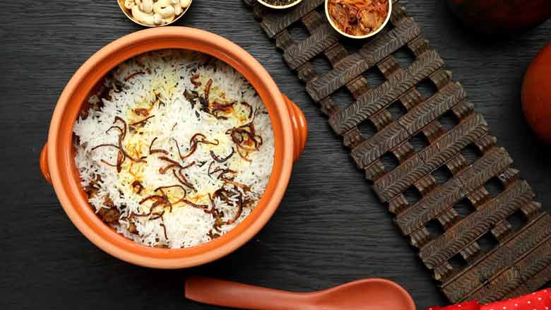 Unseal lid on the table for everybody to enjoy the aroma of the dum biryani - Hyderabadi Dum Biryani Recipe