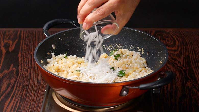 Add grated coconut and stir through - Sabudana Khichdi Recipe