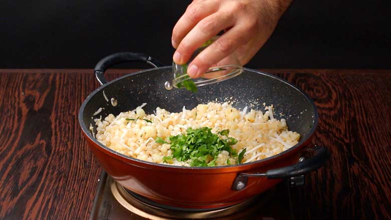 Squeeze in lime juice, add sugar, and fresh coriander leaves - Sabudana Khichdi Recipe
