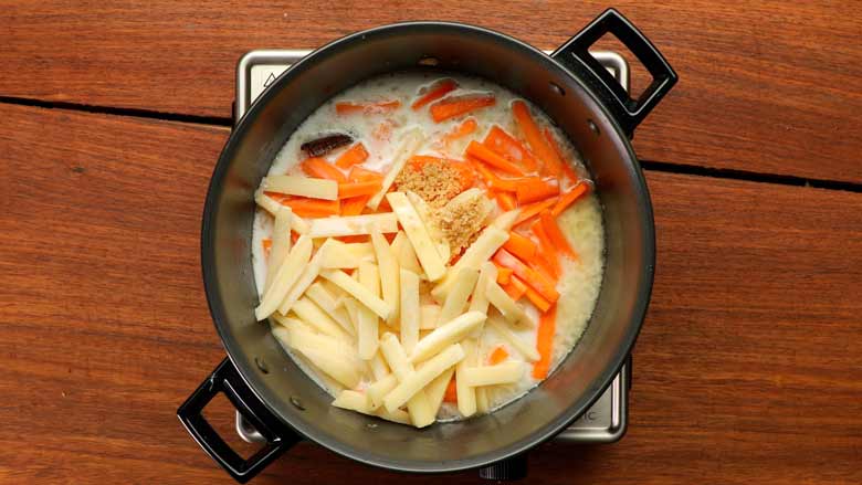 Add water, then tip in carrots and potatoes along with thin coconut milk and sea salt - Vegetable Stew Recipe Kerala Style