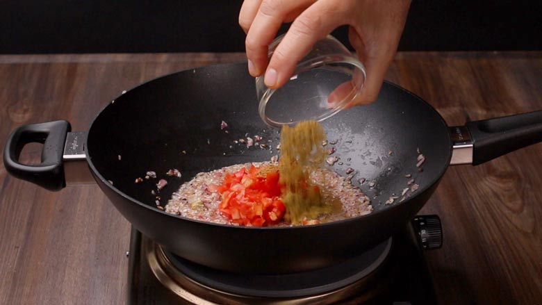 Adding tomato and cumin powder to the masala - Dhungar Paneer Masala