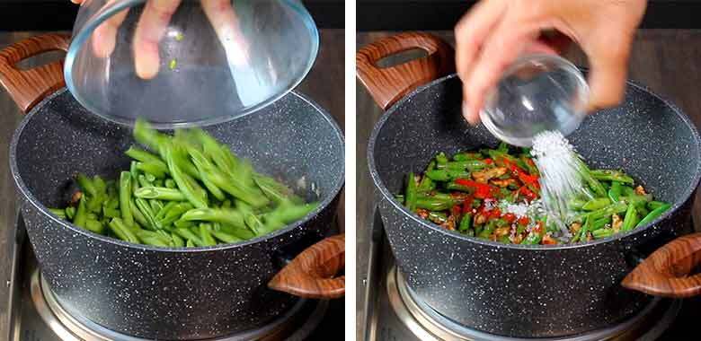 fresh green beans are being added from a glass bowl to a speckled grey and white non-stick pan on the left side while salt and red chilli powder is being added to the pan on the right - Indian Green Beans with Walnuts Recipe Caption: Add fresh green beans and salt and red chilli powder