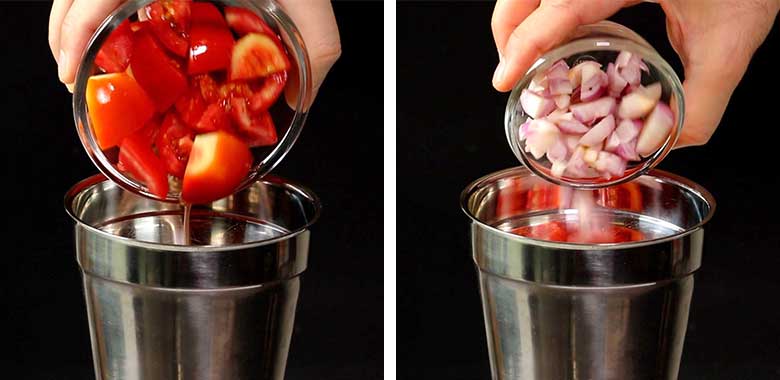 On the left side, chopped tomatoes are being tipped into a steel wet grinder from a glass bowl while on the right, chopped onions are being tipped into the same grinder over the tomatoes. There is a black background - Mexican Rice Recipe