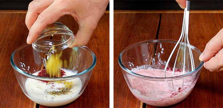 A hand is tipping lime zest from a glass bowl into a larger glass bowl on a wooden countertop with yogurt, sumac, salt, and dried oregano in it on the left side while the same yogurt mixture is being whisked with a balloon whisk on the right side of the image - Pasta with Herb Butter Sauce Recipe